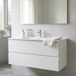 Waschtisch mit Unterschrank in 100 cm Breite an einer gefliesten Wand im Badezimmer
